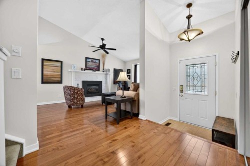 91 Hawkley Valley Road Nw, Calgary, AB - Indoor With Fireplace