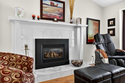 91 Hawkley Valley Road Nw, Calgary, AB - Indoor Photo Showing Living Room With Fireplace