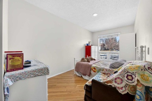 100 Strathcona Close Sw, Calgary, AB - Indoor Photo Showing Bedroom