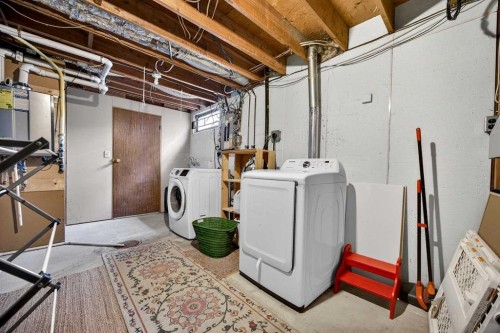 100 Strathcona Close Sw, Calgary, AB - Indoor Photo Showing Laundry Room