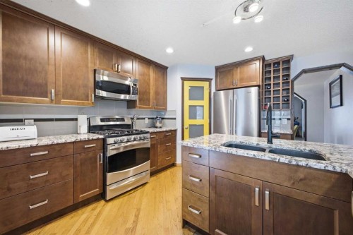 46 Sunset Way Se, Calgary, AB - Indoor Photo Showing Kitchen With Stainless Steel Kitchen