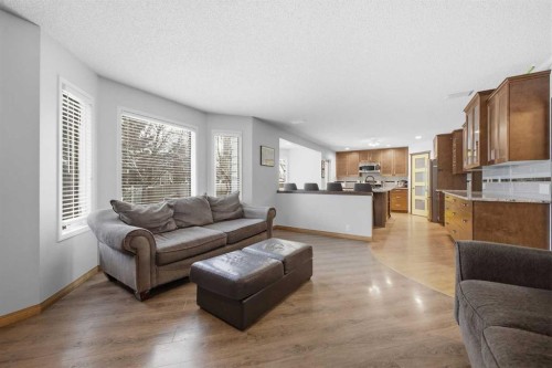 46 Sunset Way Se, Calgary, AB - Indoor Photo Showing Living Room