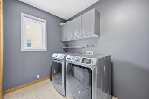 46 Sunset Way Se, Calgary, AB - Indoor Photo Showing Laundry Room