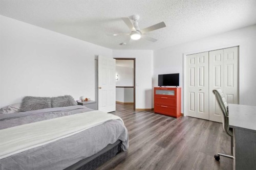 46 Sunset Way Se, Calgary, AB - Indoor Photo Showing Bedroom