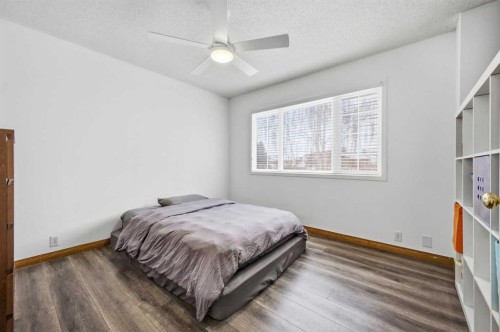 46 Sunset Way Se, Calgary, AB - Indoor Photo Showing Bedroom