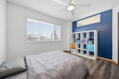 46 Sunset Way Se, Calgary, AB - Indoor Photo Showing Bedroom