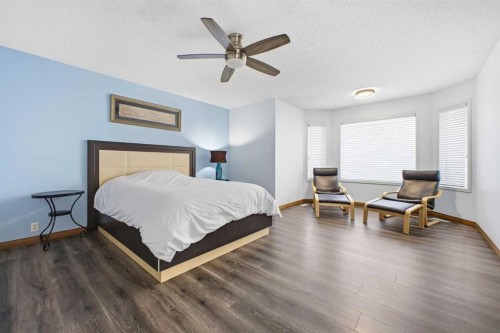 46 Sunset Way Se, Calgary, AB - Indoor Photo Showing Bedroom