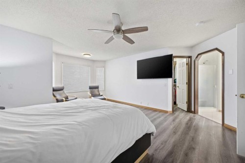 46 Sunset Way Se, Calgary, AB - Indoor Photo Showing Bedroom