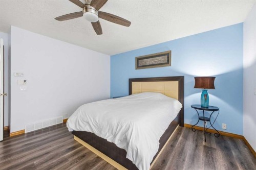 46 Sunset Way Se, Calgary, AB - Indoor Photo Showing Bedroom