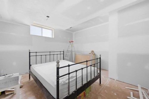 46 Sunset Way Se, Calgary, AB - Indoor Photo Showing Bedroom