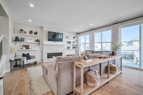 32 Magnolia Heath Se, Calgary, AB - Indoor Photo Showing Living Room With Fireplace