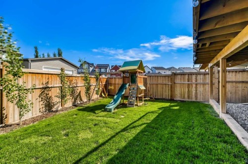 32 Magnolia Heath Se, Calgary, AB - Outdoor With Backyard