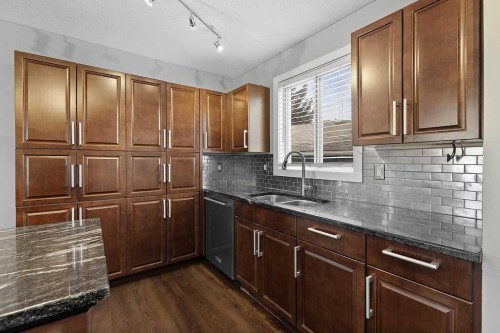 240 Riverbrook Way Se, Calgary, AB - Indoor Photo Showing Kitchen With Double Sink
