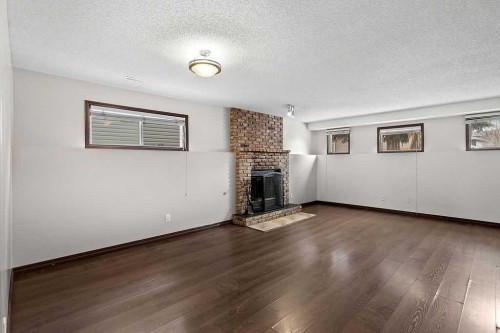 240 Riverbrook Way Se, Calgary, AB - Indoor With Fireplace