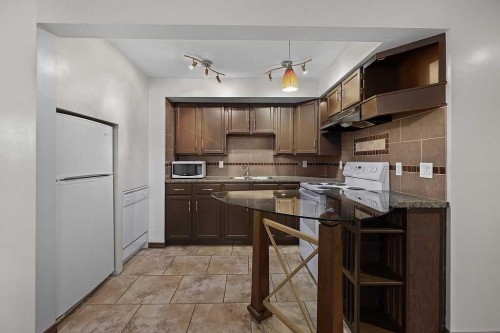 240 Riverbrook Way Se, Calgary, AB - Indoor Photo Showing Kitchen