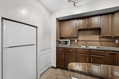 240 Riverbrook Way Se, Calgary, AB - Indoor Photo Showing Kitchen With Double Sink