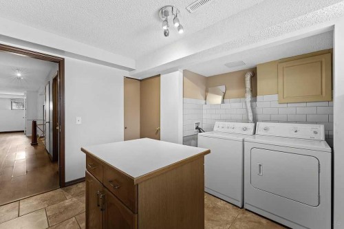 240 Riverbrook Way Se, Calgary, AB - Indoor Photo Showing Laundry Room