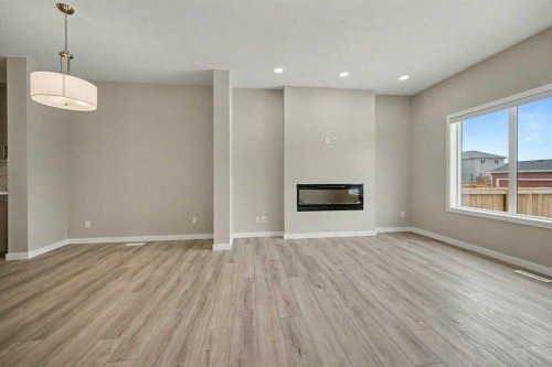 228 Walgrove Way Se, Calgary, AB - Indoor Photo Showing Living Room With Fireplace