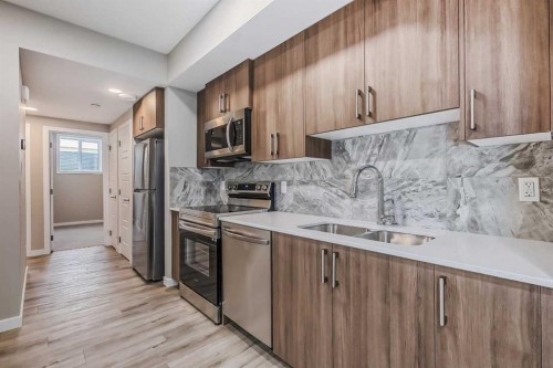 228 Walgrove Way Se, Calgary, AB - Indoor Photo Showing Kitchen With Double Sink