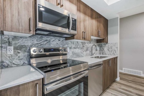 228 Walgrove Way Se, Calgary, AB - Indoor Photo Showing Kitchen With Double Sink With Upgraded Kitchen
