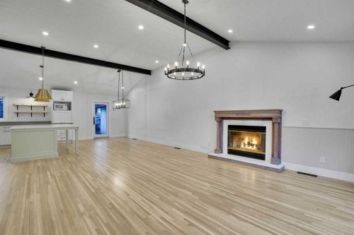 64 Hartford Road Nw, Calgary, AB - Indoor Photo Showing Other Room With Fireplace