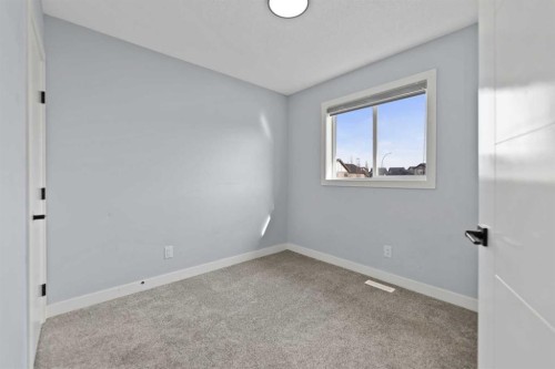 102 Martin Crossing Grove Ne, Calgary, AB - Indoor Photo Showing Other Room