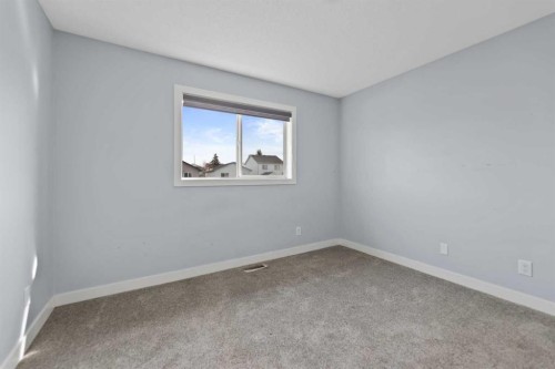 102 Martin Crossing Grove Ne, Calgary, AB - Indoor Photo Showing Other Room