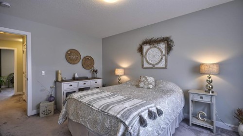135 Reunion Loop Nw, Airdrie, AB - Indoor Photo Showing Bedroom