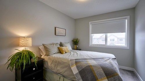 135 Reunion Loop Nw, Airdrie, AB - Indoor Photo Showing Bedroom