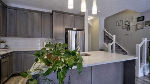 135 Reunion Loop Nw, Airdrie, AB - Indoor Photo Showing Kitchen With Double Sink
