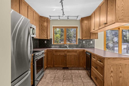 933 15Th Street, Canmore, AB - Indoor Photo Showing Kitchen With Double Sink