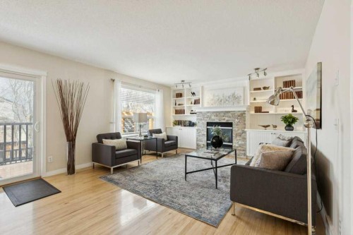 232 Oakmere Place, Chestermere, AB - Indoor Photo Showing Living Room With Fireplace