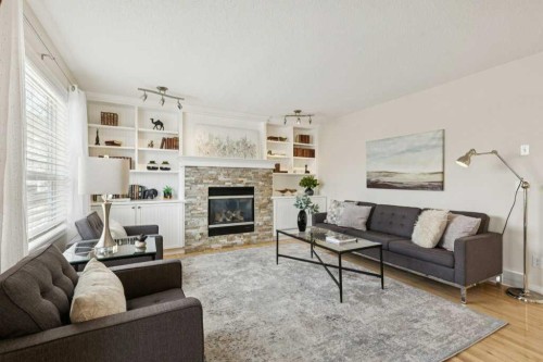 232 Oakmere Place, Chestermere, AB - Indoor Photo Showing Living Room With Fireplace