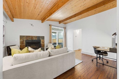 2623 Glenmount Drive Sw, Calgary, AB - Indoor Photo Showing Living Room With Fireplace