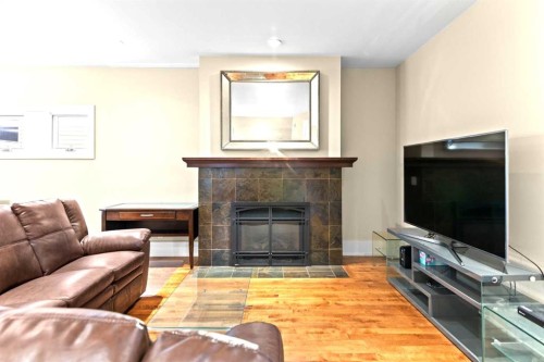 1428 2A Street Nw, Calgary, AB - Indoor Photo Showing Living Room With Fireplace