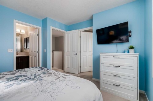 20 Copperpond Rise Se, Calgary, AB - Indoor Photo Showing Bedroom
