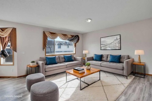 17 Taracove Crescent Ne, Calgary, AB - Indoor Photo Showing Living Room
