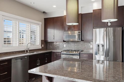 595 Panamount Boulevard Nw, Calgary, AB - Indoor Photo Showing Kitchen With Stainless Steel Kitchen With Upgraded Kitchen