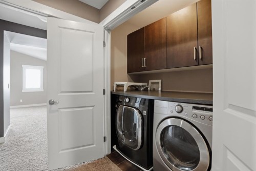 595 Panamount Boulevard Nw, Calgary, AB - Indoor Photo Showing Laundry Room
