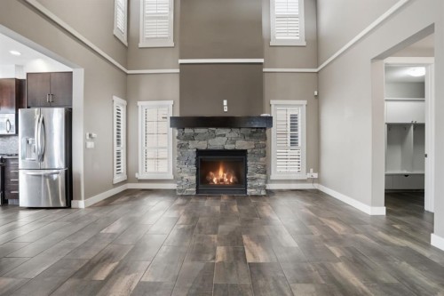 595 Panamount Boulevard Nw, Calgary, AB - Indoor Photo Showing Living Room With Fireplace