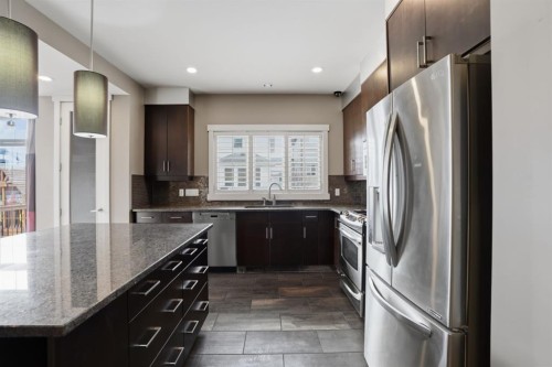 595 Panamount Boulevard Nw, Calgary, AB - Indoor Photo Showing Kitchen With Stainless Steel Kitchen