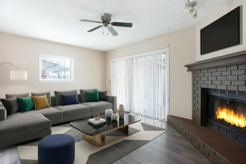 17 Martindale Drive Ne, Calgary, AB - Indoor Photo Showing Living Room With Fireplace