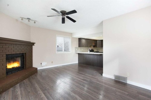 17 Martindale Drive Ne, Calgary, AB - Indoor Photo Showing Living Room With Fireplace