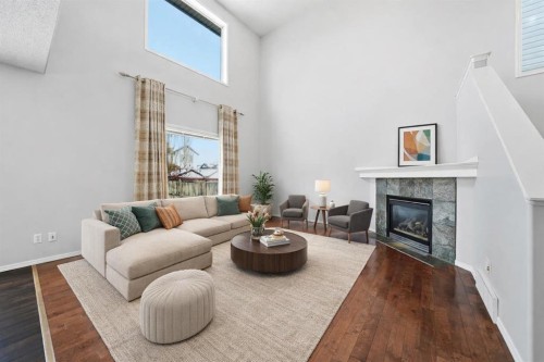 1076 Cranston Drive Se, Calgary, AB - Indoor Photo Showing Living Room With Fireplace