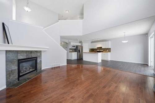 1076 Cranston Drive Se, Calgary, AB - Indoor Photo Showing Living Room With Fireplace