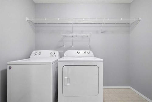 1076 Cranston Drive Se, Calgary, AB - Indoor Photo Showing Laundry Room