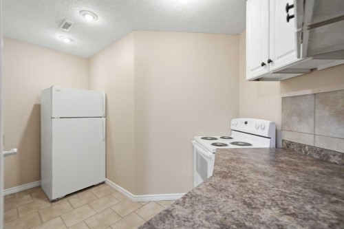 1076 Cranston Drive Se, Calgary, AB - Indoor Photo Showing Kitchen