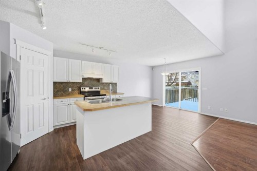 1076 Cranston Drive Se, Calgary, AB - Indoor Photo Showing Kitchen With Double Sink
