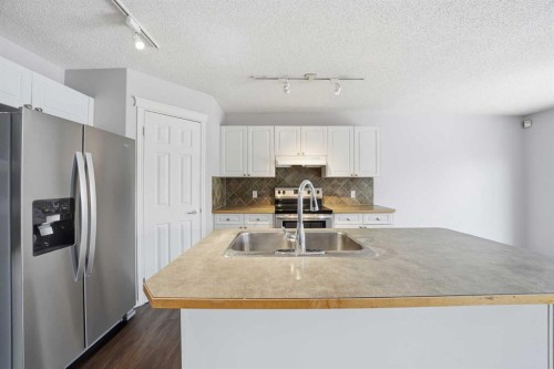 1076 Cranston Drive Se, Calgary, AB - Indoor Photo Showing Kitchen With Upgraded Kitchen