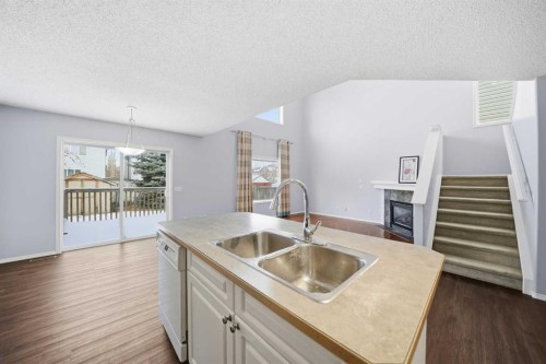 1076 Cranston Drive Se, Calgary, AB - Indoor Photo Showing Kitchen With Double Sink